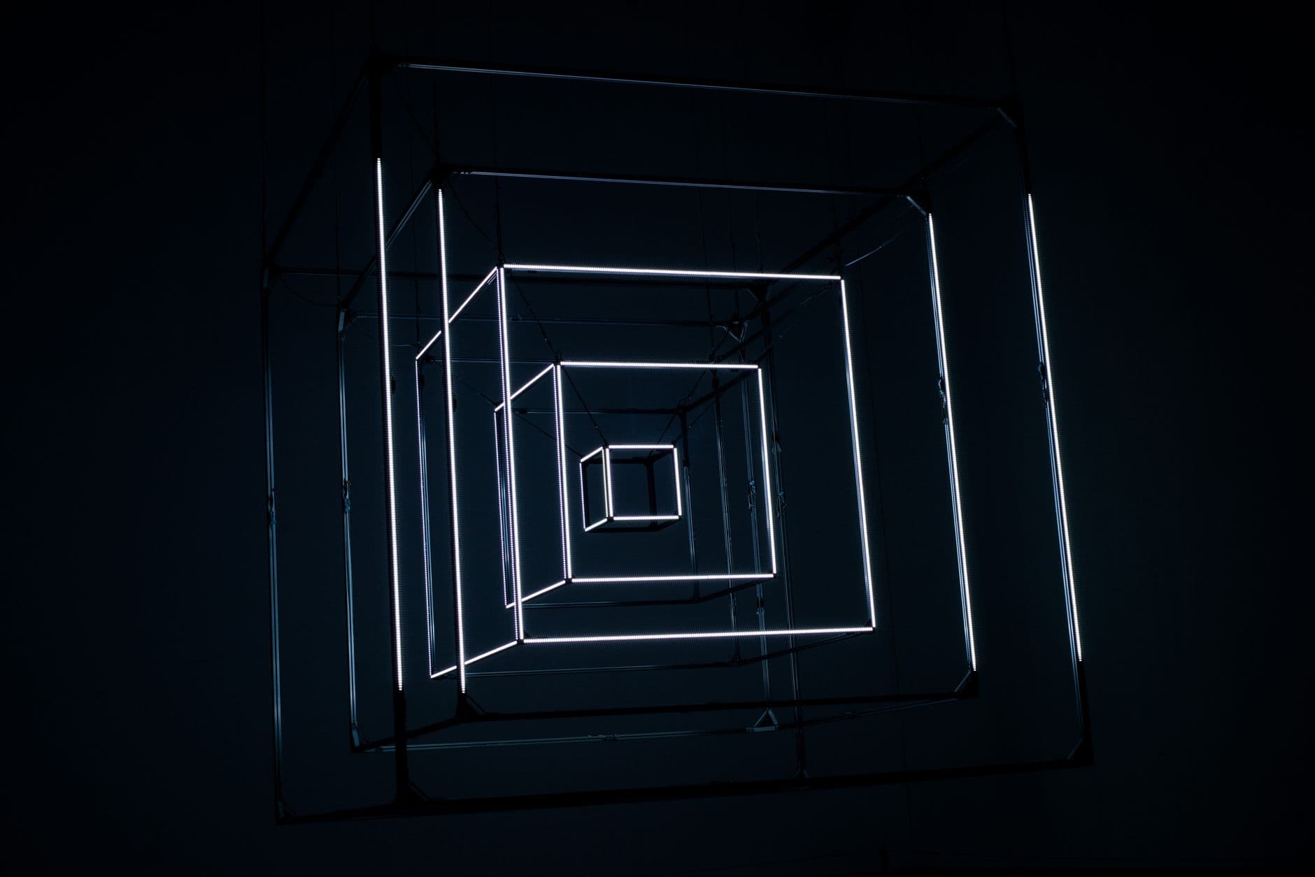 An abstract lattice of light receding into darkness