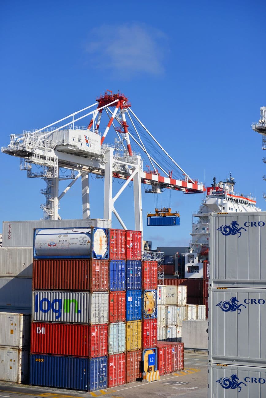 A container crane loading a ship at port