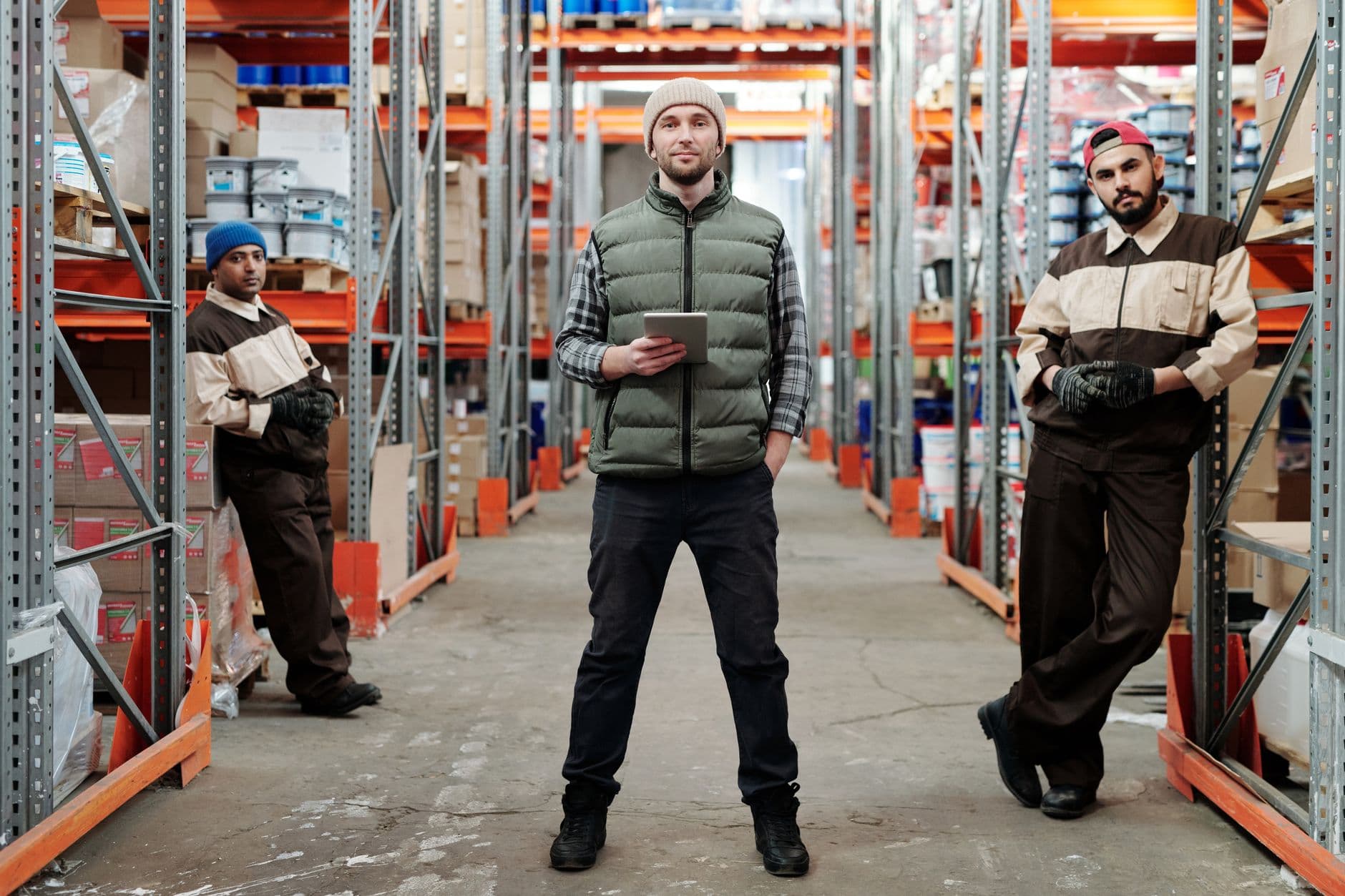 Warehouse operatives on a shift between racking aisles